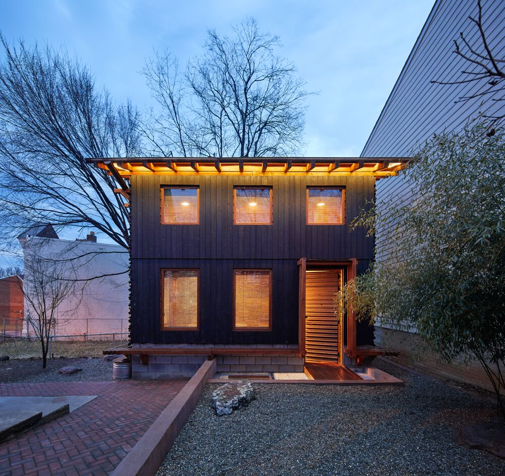 Image of Grass House at night