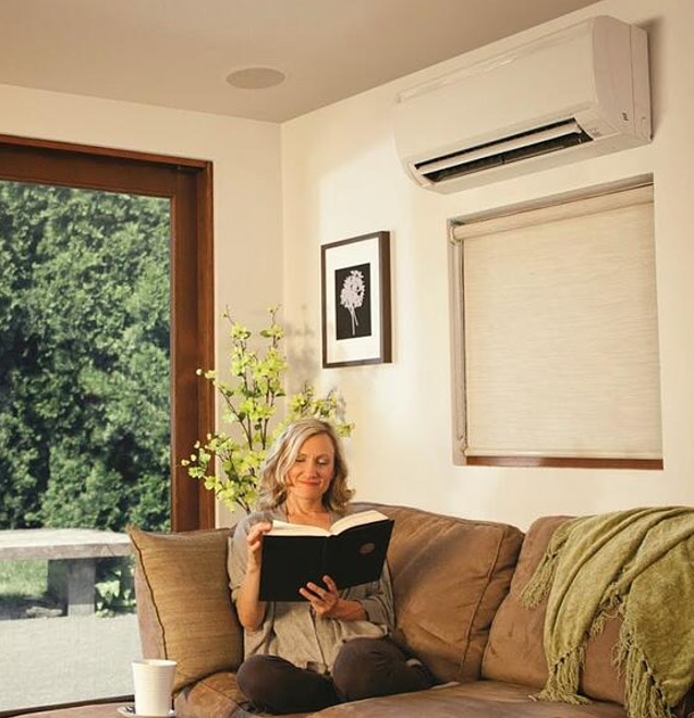 woman sitting and reading in a living room