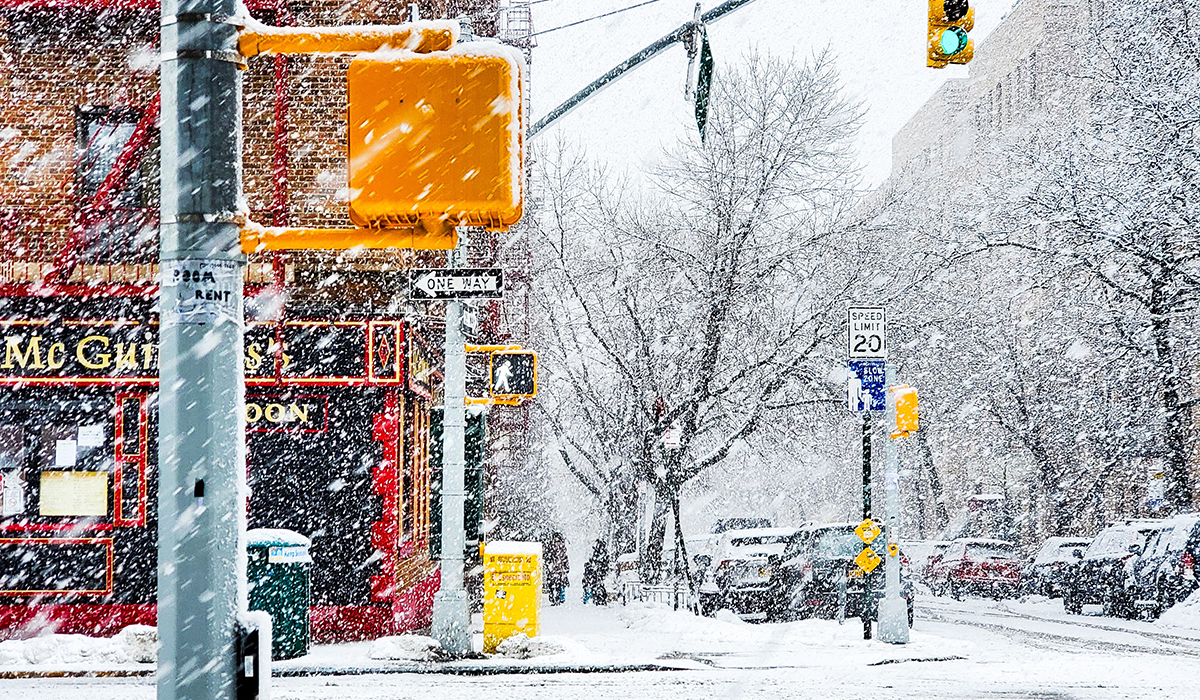 Snow falling in New York City.